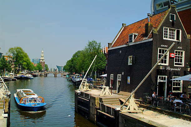 нидерланды, амстердам - montelbaan tower стоковые фото и изображения