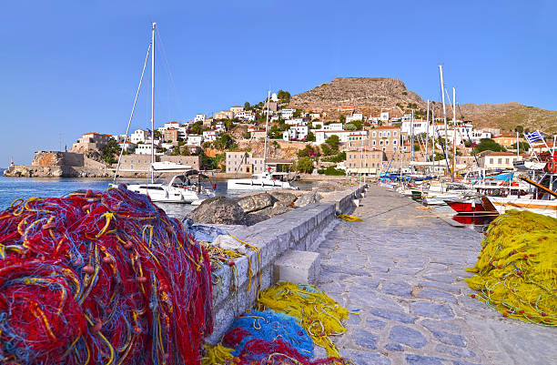 port with fishing boats and nets at Hydra island Greece