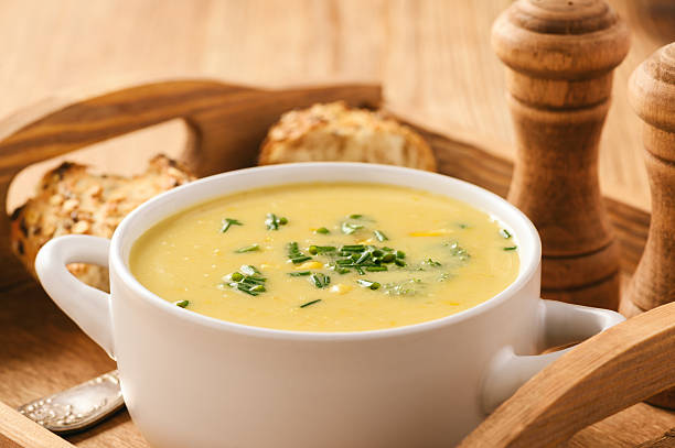 istock Corn cream soup on wooden background. 637444392
