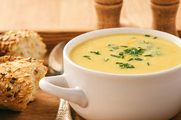 istock Corn cream soup on wooden background. 637444492