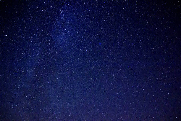 istock The starry sky and the mist over the land 637457872