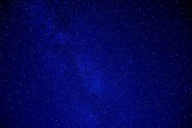 istock The starry sky and the mist over the land 637457924