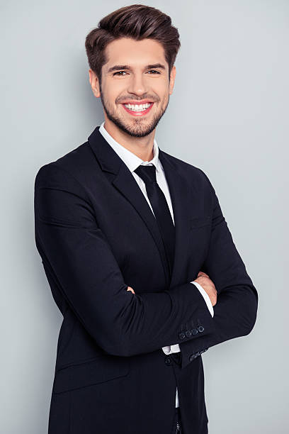 istock Successful businessman with beaming smile standing 637458054
