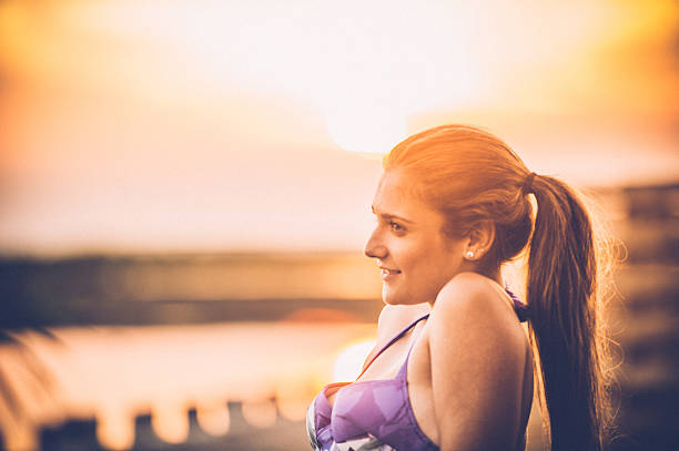 istock Cute Young Woman Sunbathing 637469064