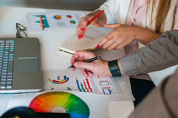 istock Casual business people working together with computer in office 637469730