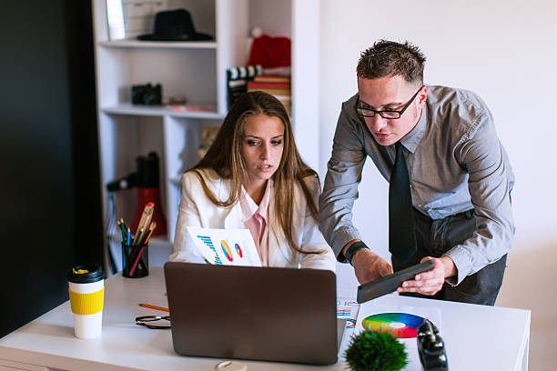 istock Casual business people working together with computer in office 637481448