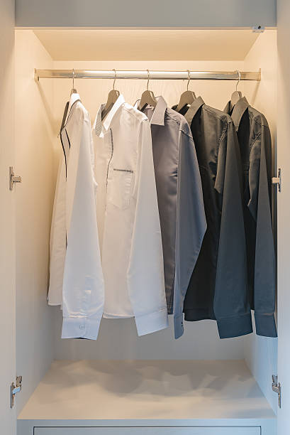 istock black and white color tone clothes hanging on rail 637482208