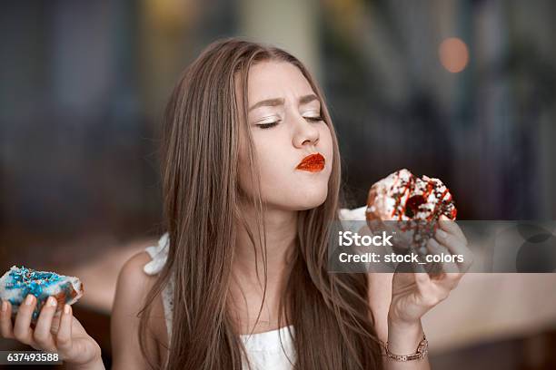 Tasting Delicious Donuts Stock Photo - Download Image Now - Eating, One Woman Only, Women