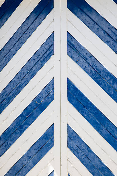 Blue and white chevron or zig zag pattern design on a wooden door