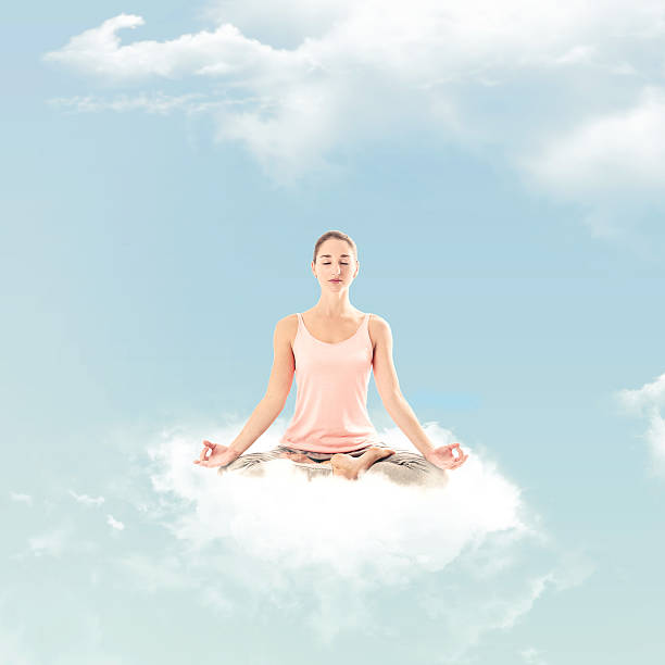 Woman doing a yoga posture on a cloud