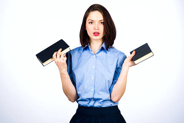 istock Young girl with books 637502258