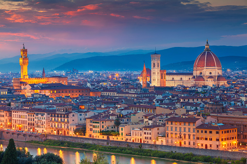 Cityscape image of Florence, Italy during dramatic sunset.