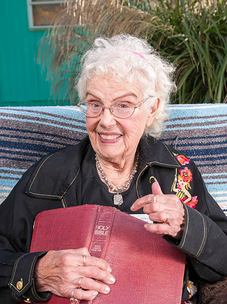 istock Senior Woman holding Bible 637507324