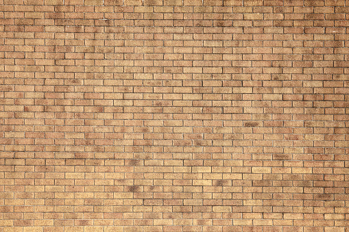 Modern large yellow brick wall background