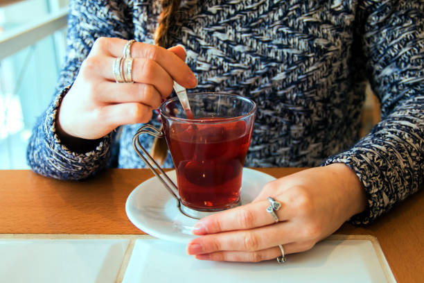istock Woman holding tea cup 637508066