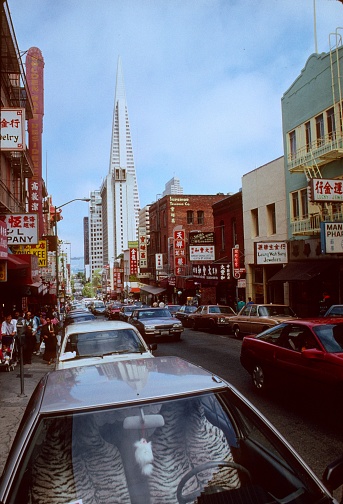 San Francisco, California, USA, September 7, 1983. Street scene on Washington St. looking towards to the Transamerica Pyramit building in San Francisco. As you can see, the Washington St. is very lively with pedestrians.