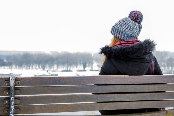 istock Woman alone during winter day. Lonely woman 637512834