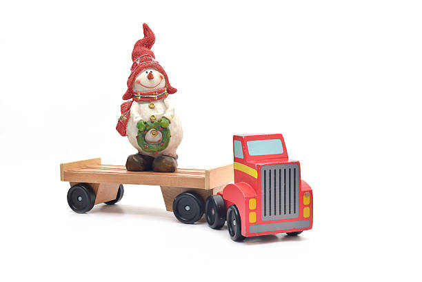 istock Snowman and Toy truck car 637515610