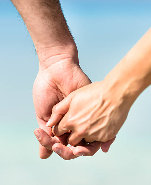 Holding Hands Stock Photo - Download Image Now - 20-29 Years