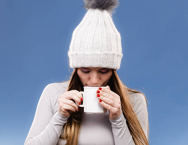 istock girl in thermal underwear drinking tea 637518210