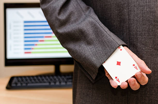 istock businessamen with aces in the sleeve 637520280