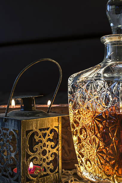 istock Engraved bottle with whisky and candle 637520456