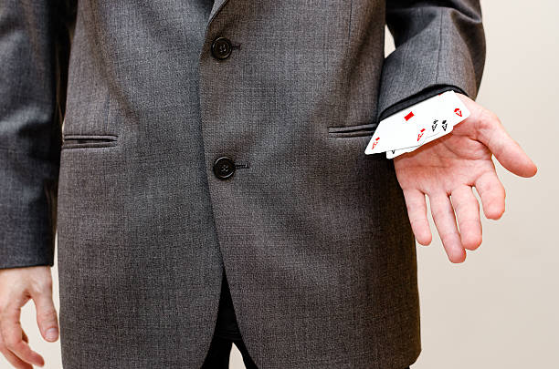 istock businessamen with aces in the sleeve 637521612
