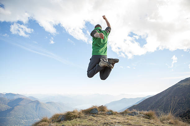 istock Young man jumping high up in the air 637521920