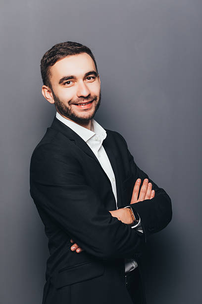 istock Young businessman in suit side crossed hands  isolated 637522352