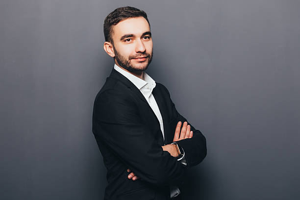 istock Young businessman in suit side crossed hands  isolated 637522406