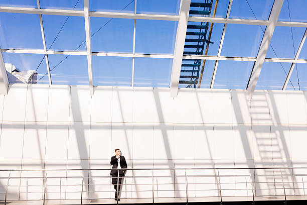 istock Modern businessman.  young man  while standing  office hall 637522762