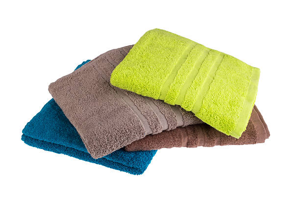 istock Pile of colored towels isolated on white background 637522770