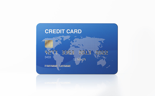 Blue credit card isolated on white background. Clipping path is included. Horizontal composition with copy space. Great use for online shopping and credit card related concepts.