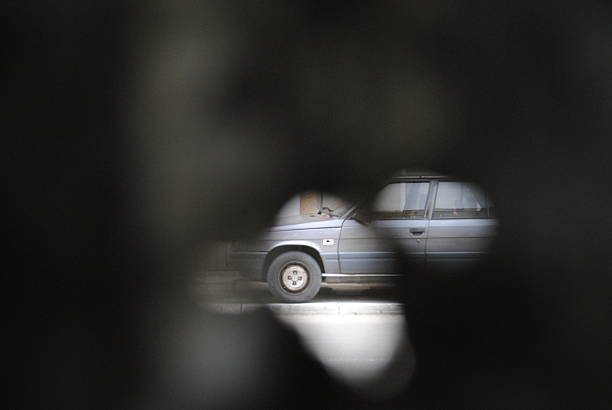 Car on a Mostar street through a bullethole