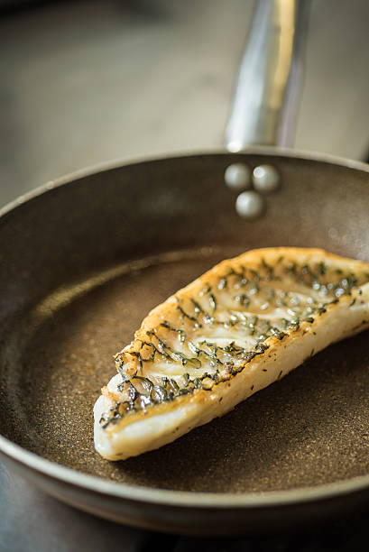Baked parrotfish fillet on a pan