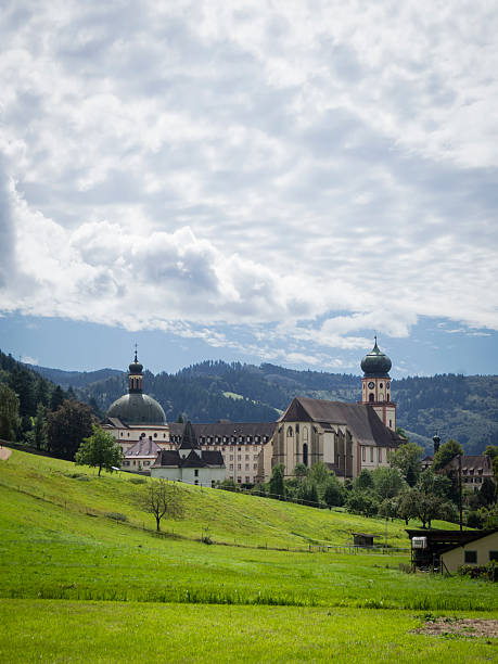 Munstertal, Germany - August 21, 2016: Church and main building of St. Trudpert's Abbey (Kloster Sankt Trudpert), a Benedictine monastery at Munstertal in the southern Black Forest (Germany).