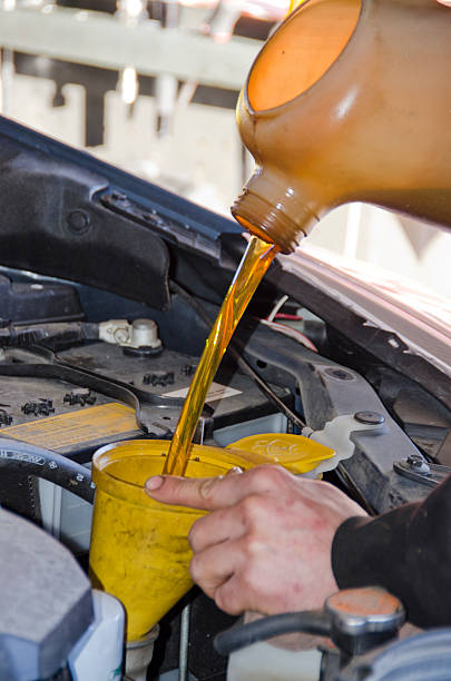 istock Filling Car Engine with Fresh Motor Oil 637527692