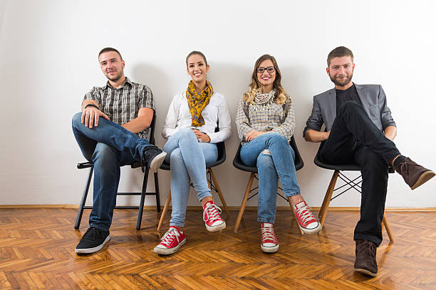 istock Four business people in a waiting room 637528112