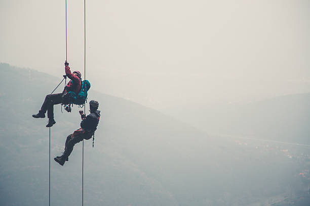 mountaineers - conquering adversity mountain hiking mountain climbing foto e immagini stock