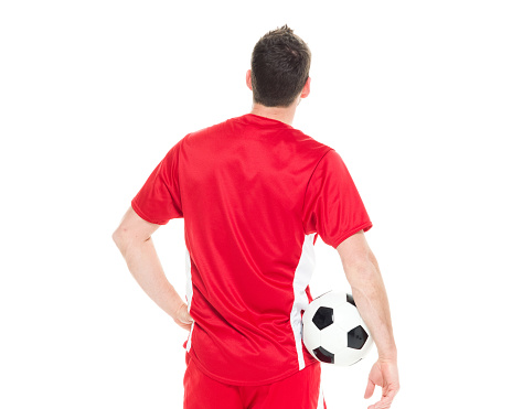 Rear view of soccer player standing