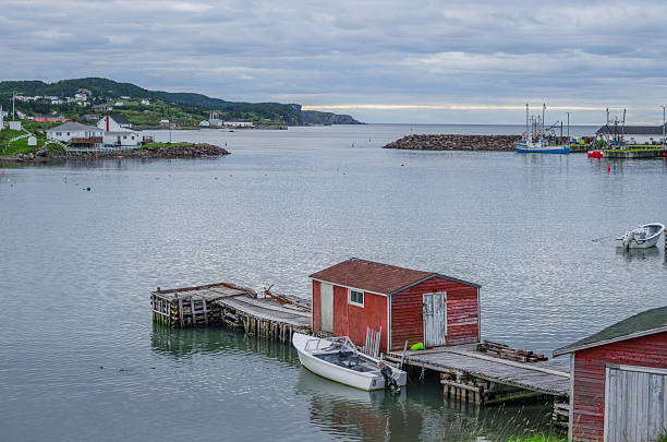 istock Little red shed & boat on a dock in Twillingate. 637533512