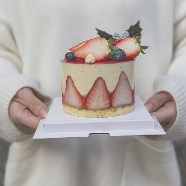 istock Woman holding strawberry cake 637535036