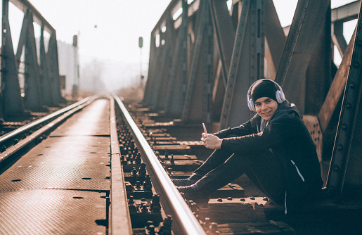 Risky man with smartphone chilling