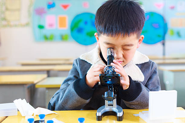 Kid Using Microscope 10,000+ Kid Looking In Microscope Stock Photos, Pictures & Royalty-Free ...