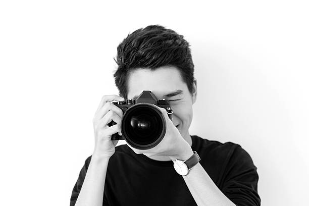 istock Young Asian Photographer 637540676