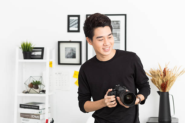 istock Young Asian Photographer 637540710