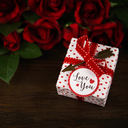 Valentine's Day gift with red roses and Love You message