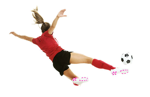 istock Female soccer player kicking 637542436