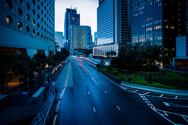 istock urban traffic with cityscape 637542800