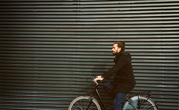 istock Young Businessman Sitting On Bicycle Outdoors. 637550110